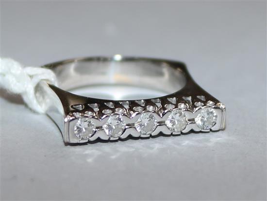 A modern white gold and five stone channel set diamond ring,